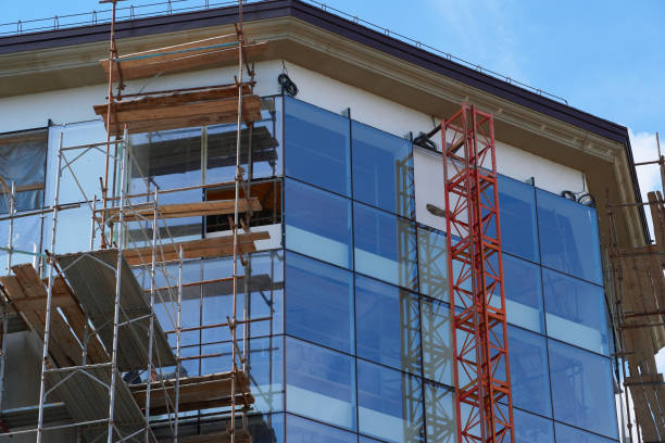 istock modern building under construction, plastered walls and scaffolding, construction crane 1254456330