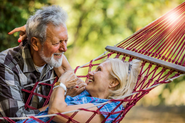 istock Senior couple relaxing in a hammock 1254458369