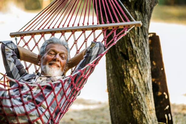 istock Senior  man laying in a haommock 1254458627