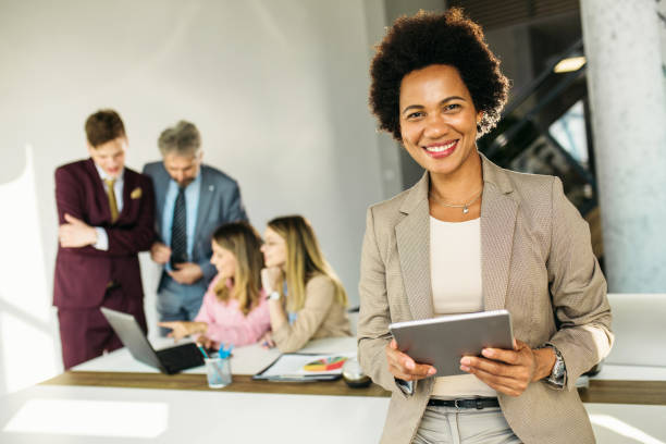 istock Businesswoman working on a digital tablet in modern office 1254461668