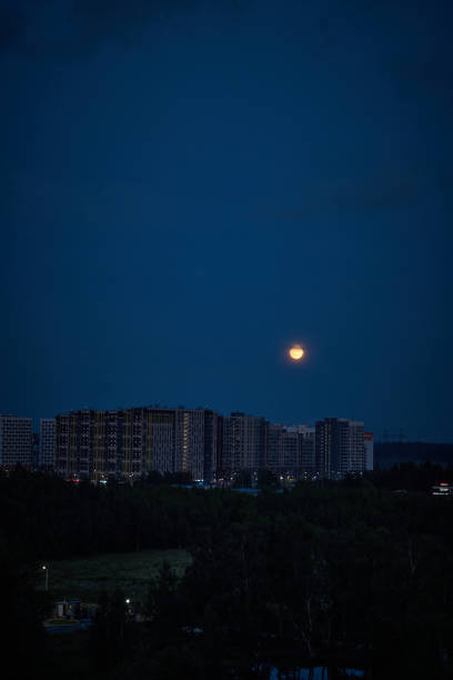 istock red moon over evening city 1254462735