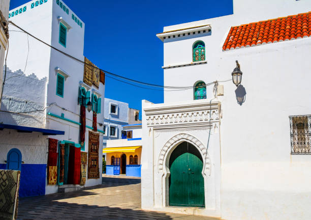 Beautiful view of street with typical arabic architecture in Asilah. Location: Asilah, North Morocco, Africa. Artistic picture. Beauty world Beautiful view of street with typical arabic architecture in Asilah. Location: Asilah, North Morocco, Africa. Artistic picture. Beauty world chefchaouen photos stock pictures, royalty-free photos & images