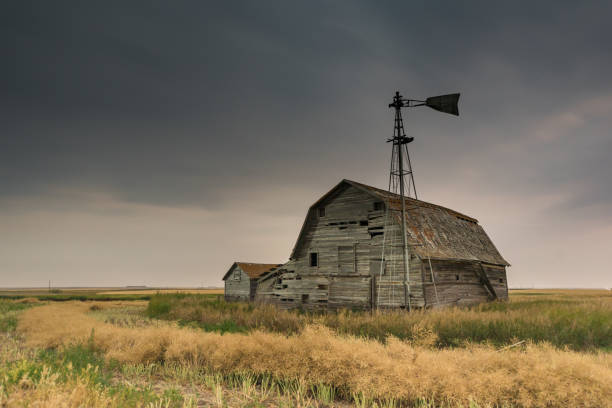 Moody sky over an abandoned prairie barn