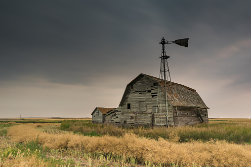 Ancient barn with peeling red paint in western USA, Colorado, USA