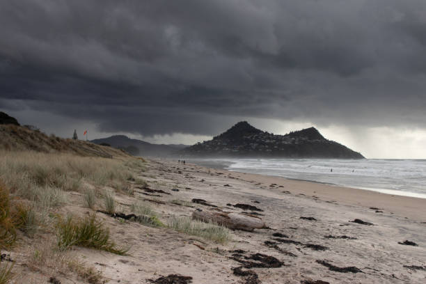 Storm clouds coming in at Pauanui Beach New Zealand Storm clouds over Pauanui Beach , New Zealand coromandel peninsula stock pictures, royalty-free photos & images