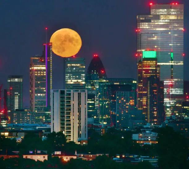 Photo of Moon rise over London Cityscape