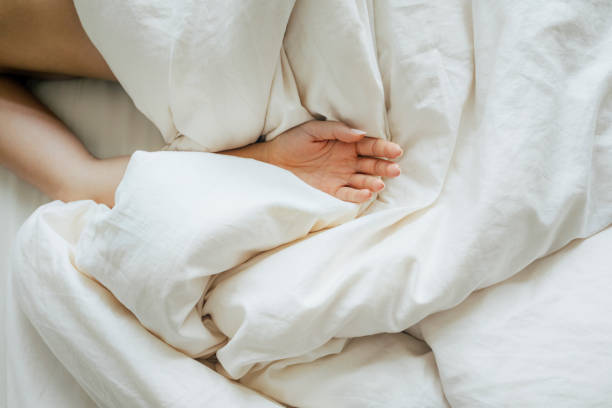 istock Arm of an Anonymous Woman Sleeping in Bed 1254467701
