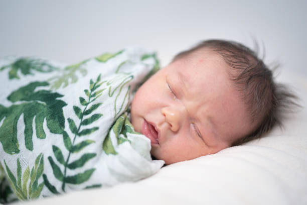 istock Mixed race infant sleeping in her diaper 1254473496