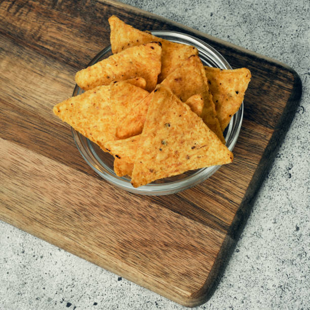 istock Corn cheese, snacks with sauce on a wooden stand. Beer snack, dish on the menu. Close up. 1254474366