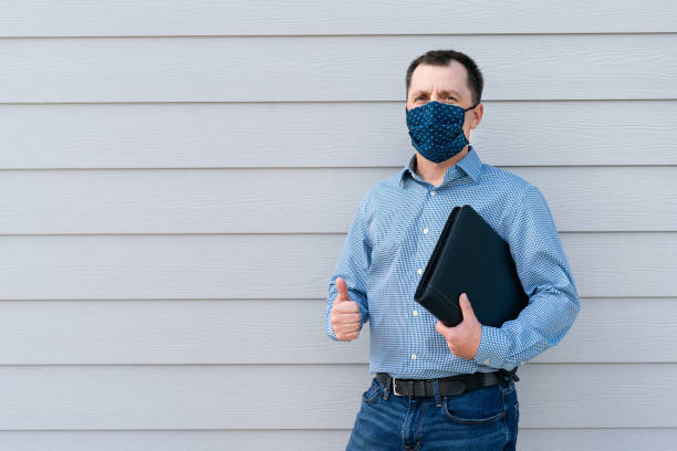 istock A builder on a finished construction site. A handsome engeneer wearing protective cotton mask during epidemic 1254475079