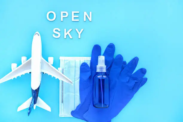 Photo of Travel after pandemic, concept. Open sky after coronavirus. Creative flat lay safety travel concept. Departure