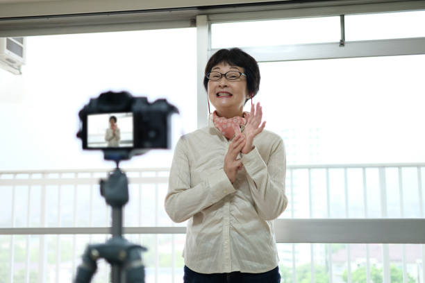 istock Senior youtuber broadcasting from home 1254479655