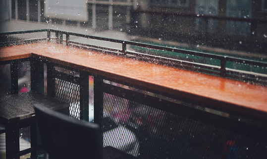 seat outside the cafe on a rainy day, Dark tone