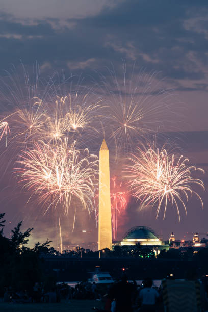 istock George Washington monument at night with fireworks 1254490388