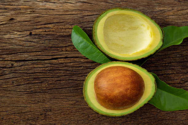 istock Avocado on a brown wooden floor 1254494891