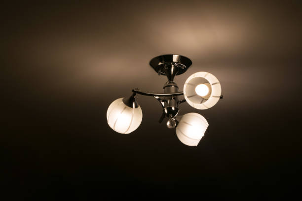 istock Glowing white chandelier on the ceiling 1254499105