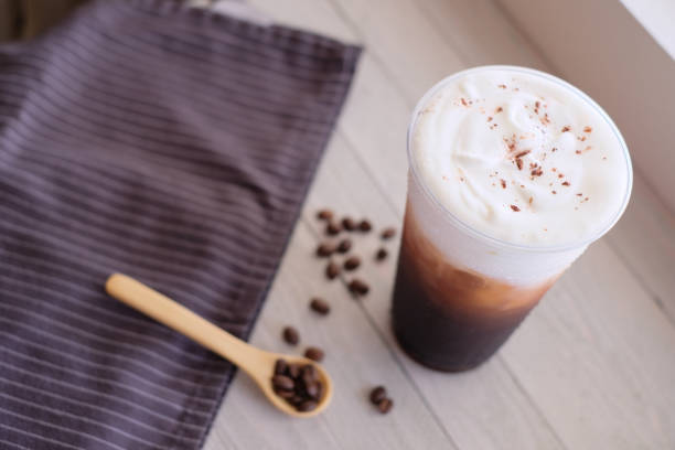 istock ice black coffee with the cream .flat lay. 1254499183