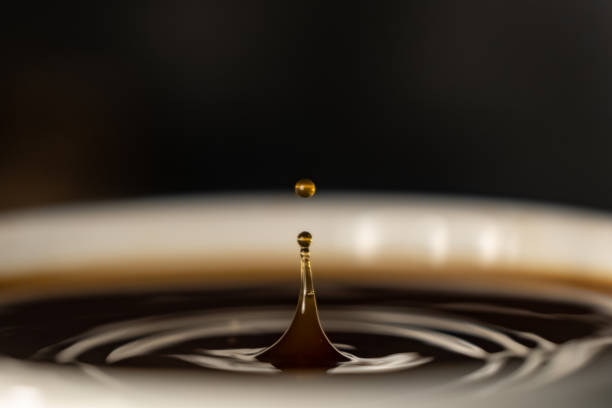 coffee splash and drop . macro close up brown liquid with smoke. coffee splash and drop . macro close up brown liquid with smoke. black coffee photos stock pictures, royalty-free photos & images