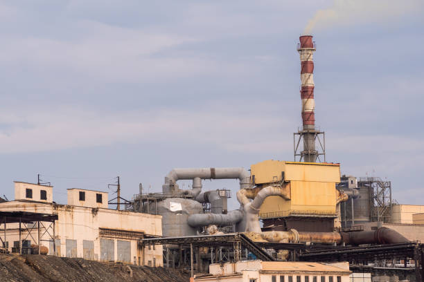 istock Metallurgical works with smoke. Industrial architecture 1254500012