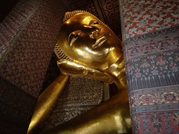 istock Huge Golden Reclining Buddha in Thailand 1254501241
