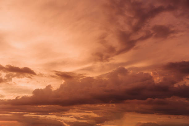 istock Beautiful sky with orange clouds in sky at sunset 1254505225