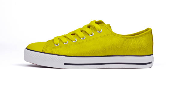 istock Single shoe isolated on white background - Yellow 1254505436