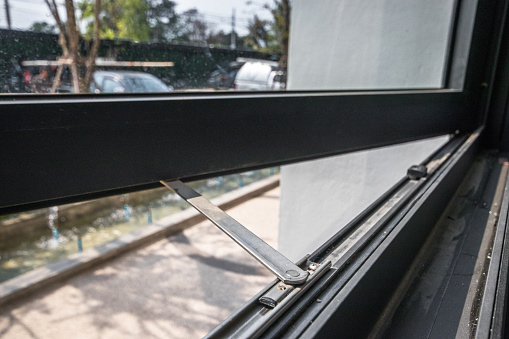 Close-Up Black iron window with mosquito net