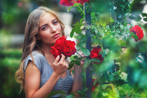 istock Girl with roses 1254511530