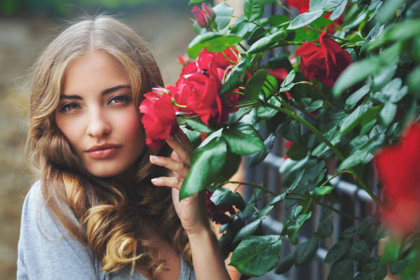 istock Girl with roses 1254511533