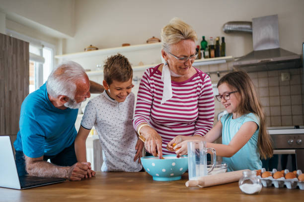 istock Grandparents preparing cookies with kids 1254512361