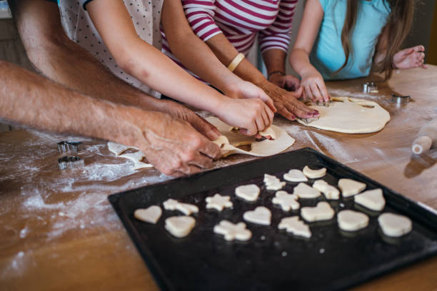 istock Family preparing cookies 1254512463