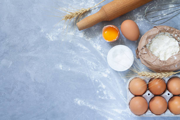 istock Bakery ingredients flour powder on stone background from above 1254515518