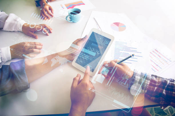 istock Businessman holding in hand tablet with global connection concept 1254516891