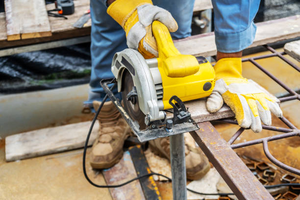 istock Carpenter using circular saw for cutting wooden boards with power tools, construction and home renovation, repair and construction tool 1254518479