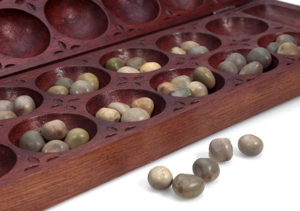 istock Awale, African Game against White Background 1254519321