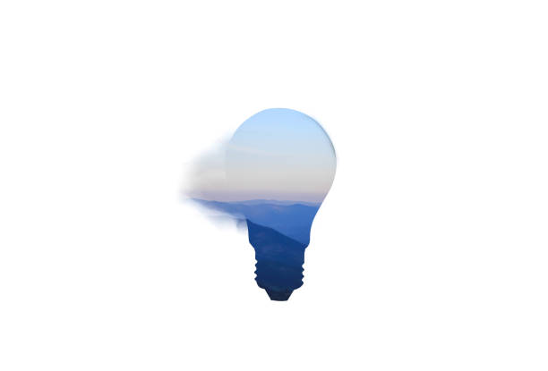Lamp bulb isolated on white background. Blue mountains inside. New idea concept.