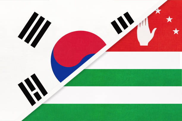 South Korea and Abkhazia, symbol of national flags from textile. Championship between two countries. South Korea or ROK and Abkhazia, symbol of national flags from textile. Relationship, partnership and championship between two Asian countries. georgia football stock illustrations