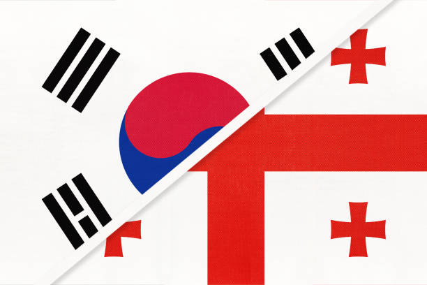 South Korea and Georgia, symbol of national flags from textile. Championship between two countries. South Korea or ROK and Georgia, symbol of national flags from textile. Relationship, partnership and championship between two Asian countries. georgia football stock illustrations