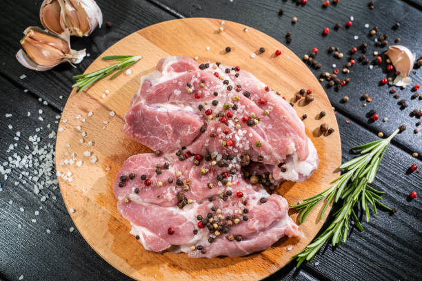 istock Raw beef steak on a dark wooden table 1254522732