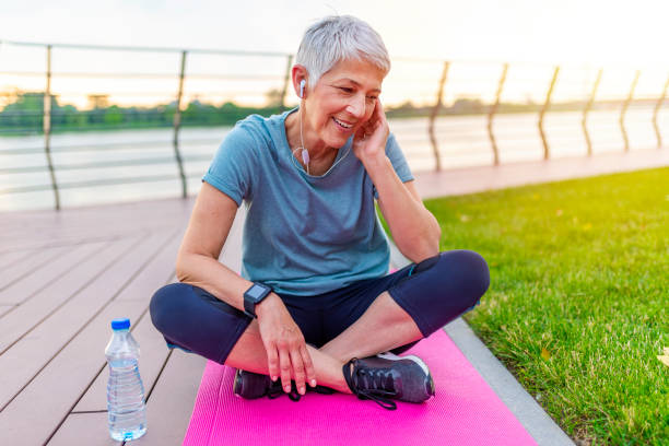 istock Senior Woman Resting After Exercising In Park. 1254526698