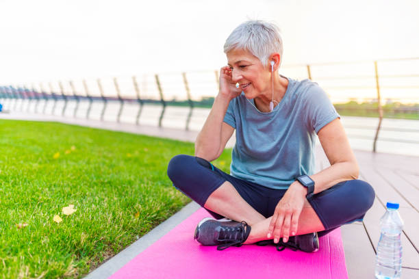 istock Senior Woman Resting After Exercising In Park. 1254526778