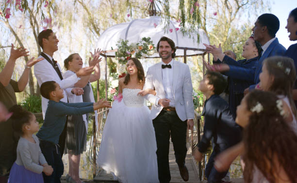 Shot of a happy young couple walking down the isle as husband and wife after their wedding ceremony