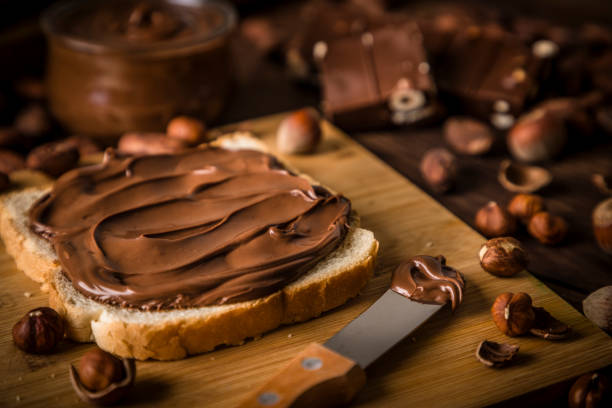istock Sliced of bread full of chocolate and hazelnut spread 1254528516