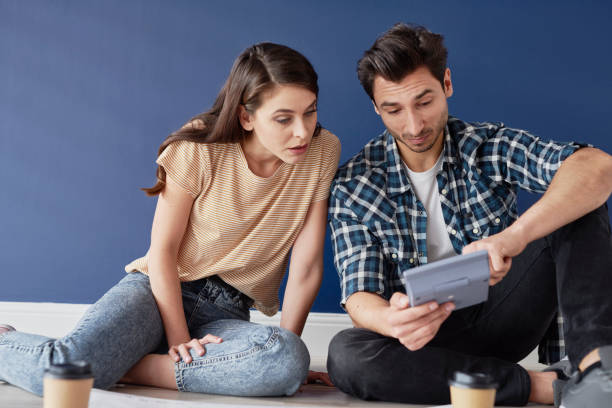 istock Couple shocked with a calculating result 1254528663