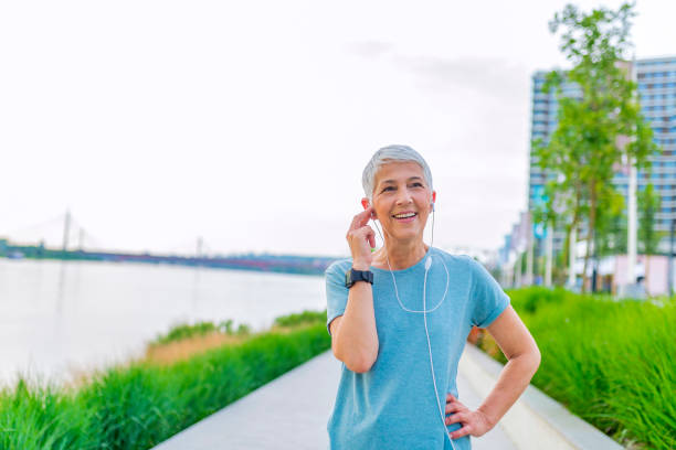 Athletic mature woman resting after jogging.