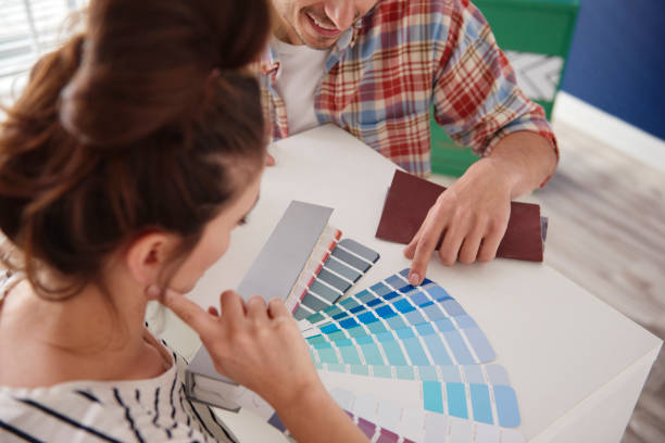 istock Couple cannot decide about the room color 1254530478