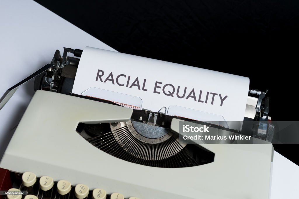 Racial Equality Racial Equality written on a paper in a typewriter Black Color Stock Photo