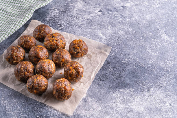 istock Fruit and nut energy balls in a plate, top view 1254533693