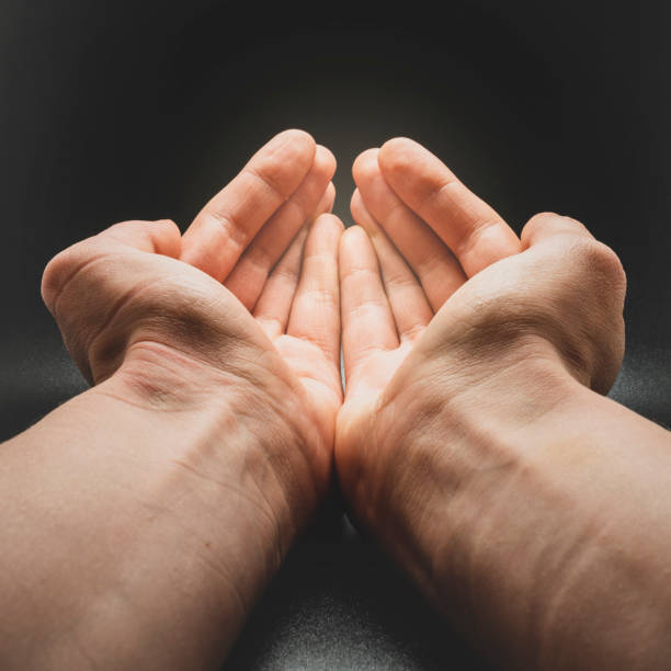 istock Hands reaching for abundance and blessing. 1254533917