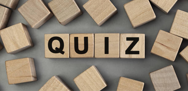 istock Word QUIZ made with wood building blocks. Top view 1254539404